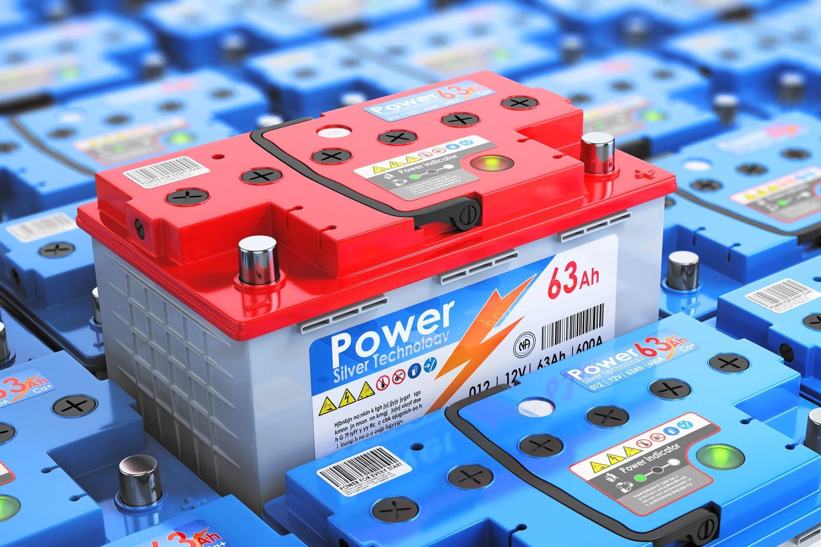 A red and gray battery sits atop a sea of blue batteries, displaying labels and indicators in a well-organized, industrial setting.