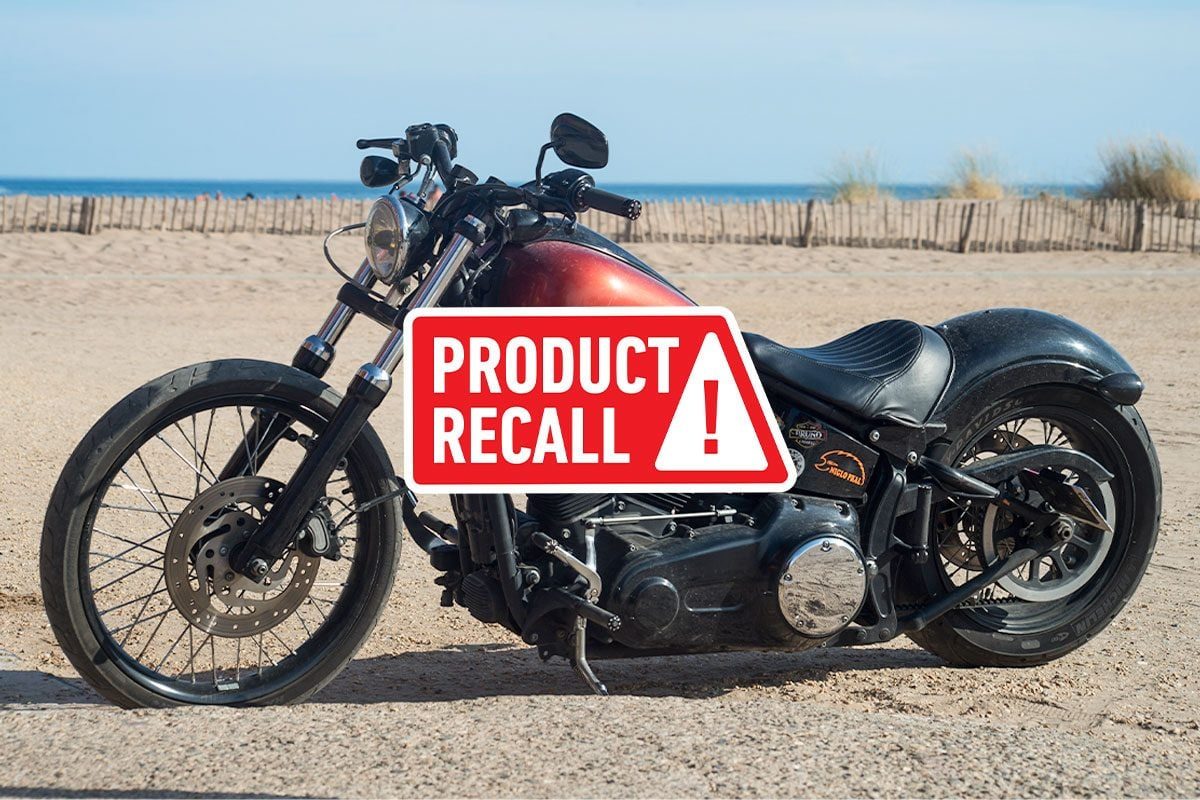 Profile view of Harley Davidson motorbike parked on the beach