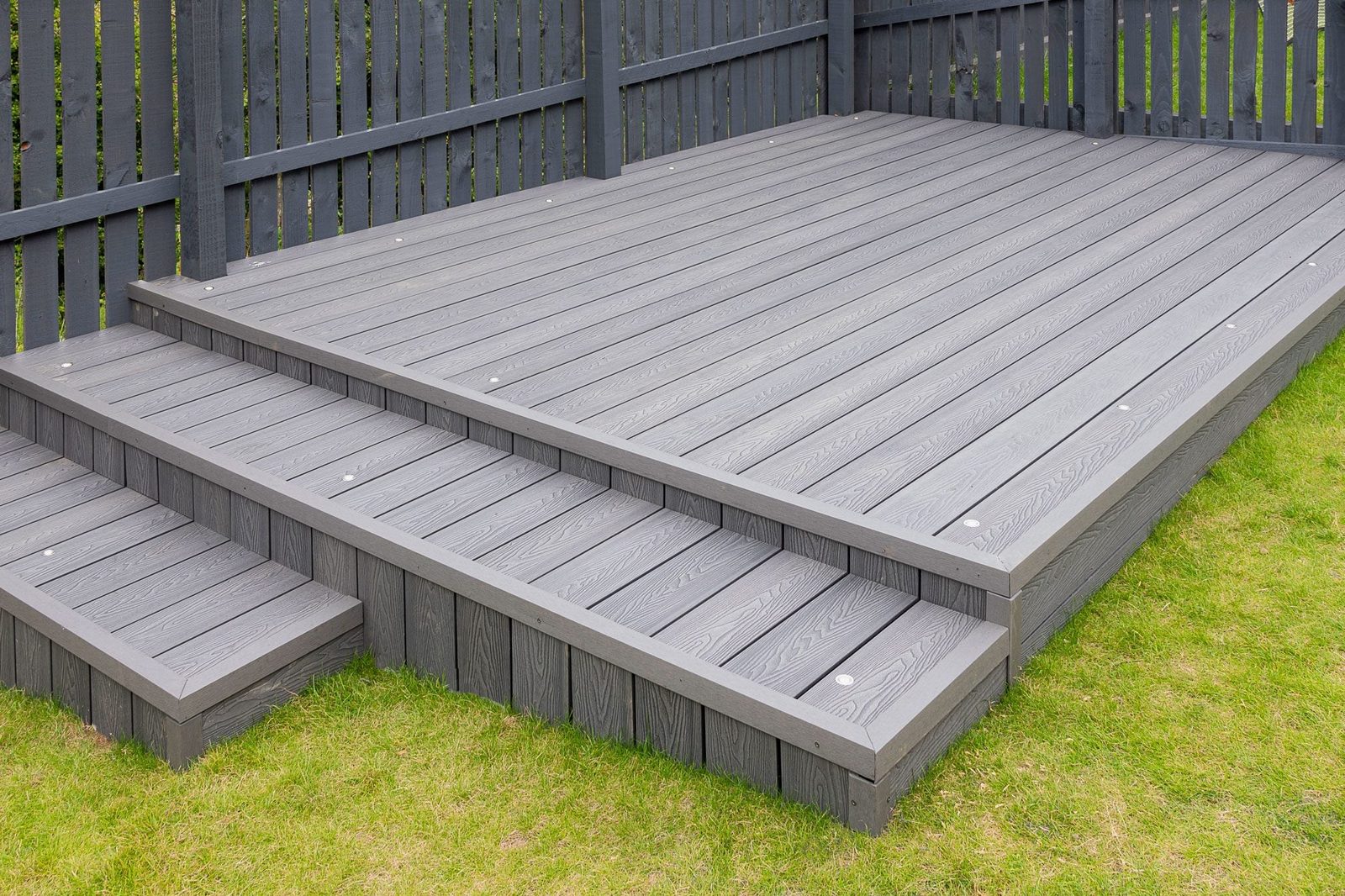 Ash Grey Composite Decking Built On Two Levels On A Residential Back Garden