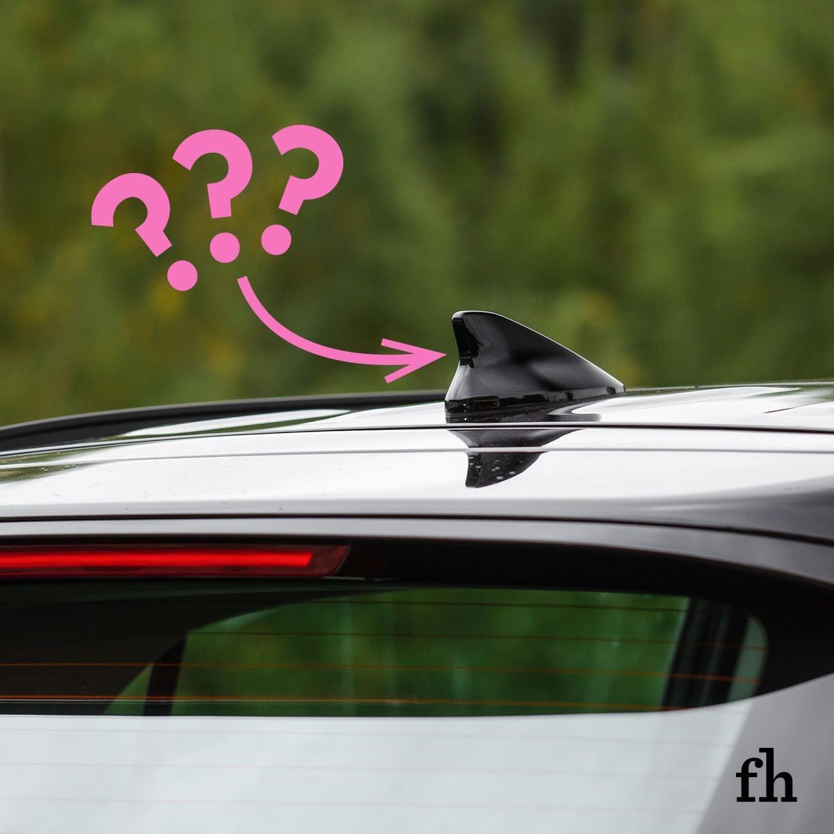close up of a car with an arrow pointing to a specific part; at the end of the arrow are question marks