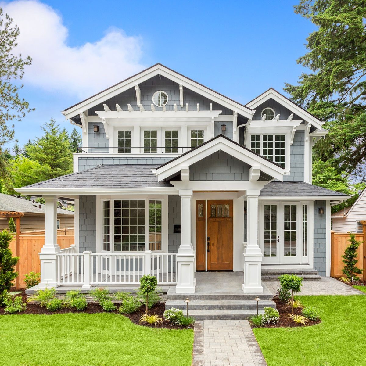 Beautiful White And Grey Luxury Home Exterior With Green Grass