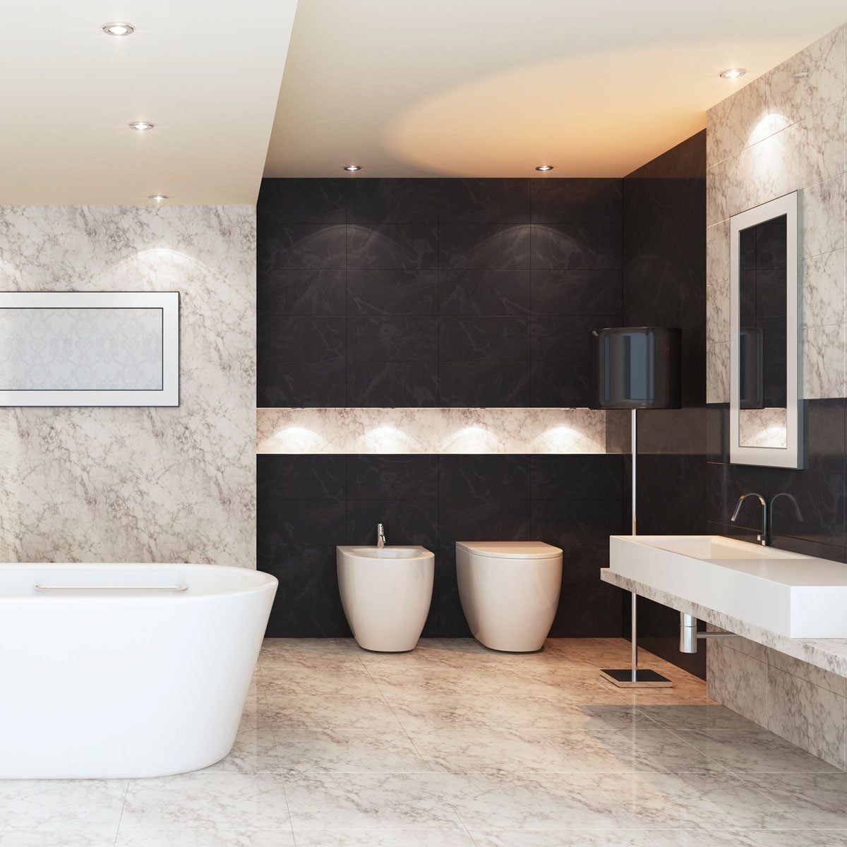 A modern bathroom features a freestanding tub, two white fixtures, and a sleek vanity against contrasting dark and light marble walls, illum