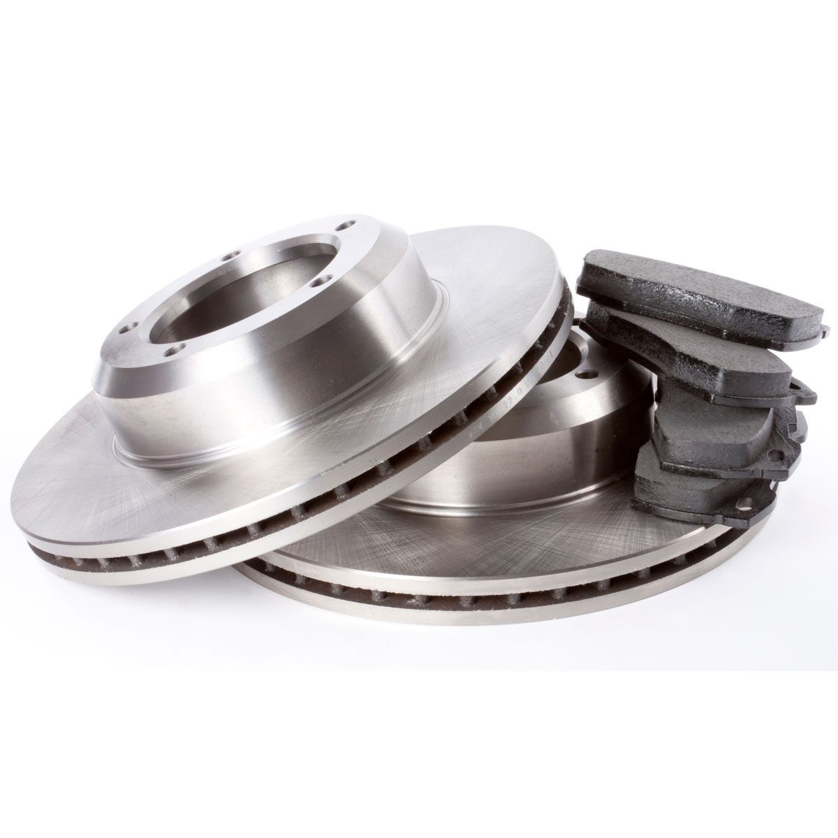 Two metallic brake discs are stacked together, accompanied by a set of dark brake pads, on a plain white background.