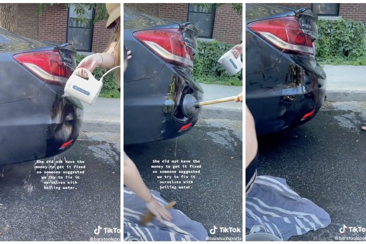 A woman pours boiling water on a car's damaged bumper, then uses a plunger to attempt repairs in a residential street setting.