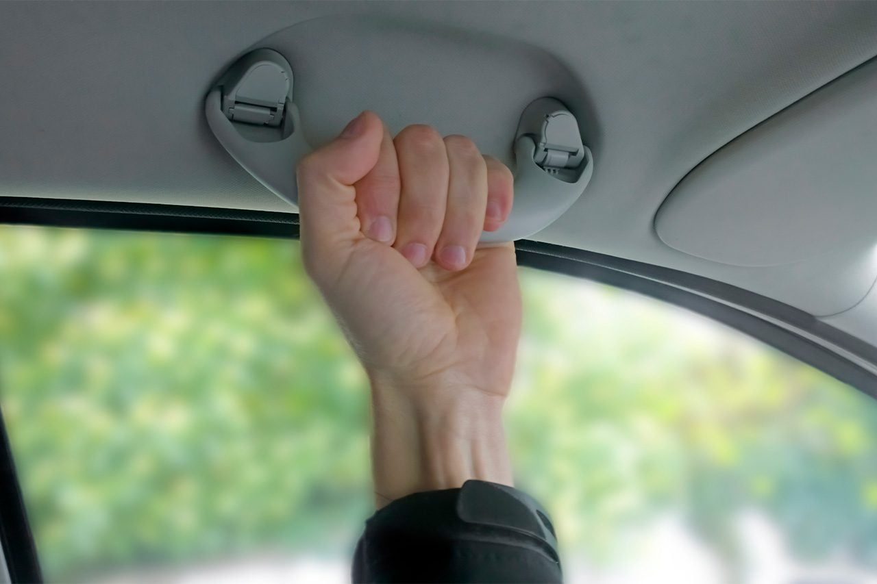 Why Do Some Cars Skip the Grab Handle Above the Driver's Seat?