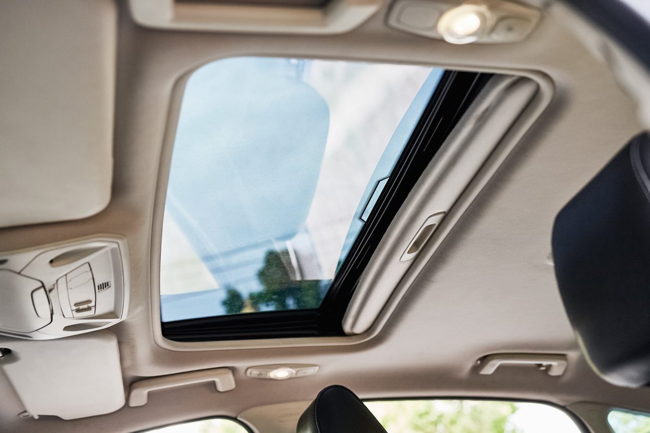 Panoramic Glass and sliding system sunroof in a car viewed from the inside