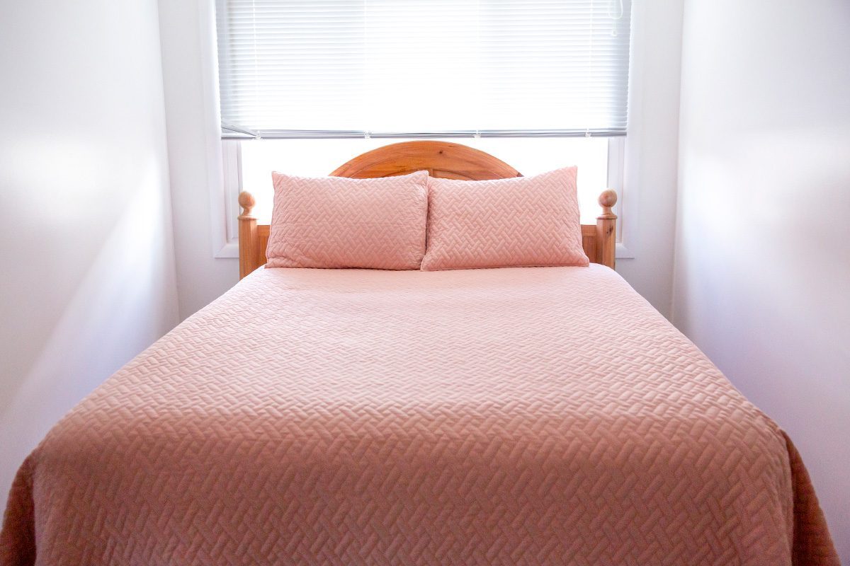 Bedroom Bed Pillows and Mattress in Tidy Room