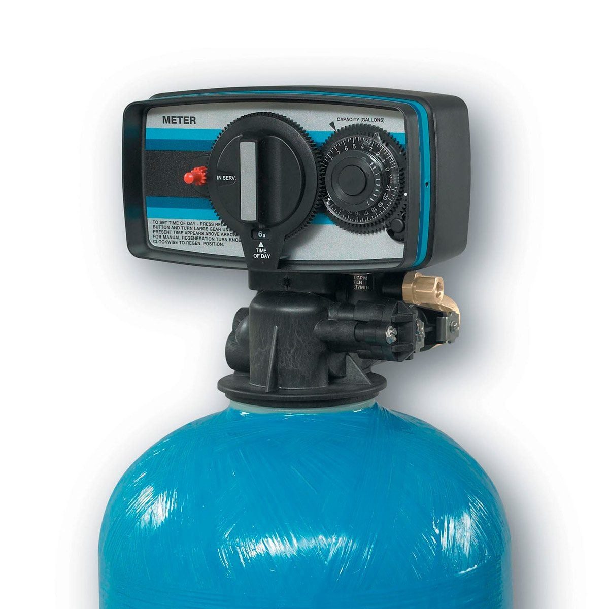 A blue tank with a control panel on top is set up for water treatment, displaying dials and buttons indicating water capacity and settings.