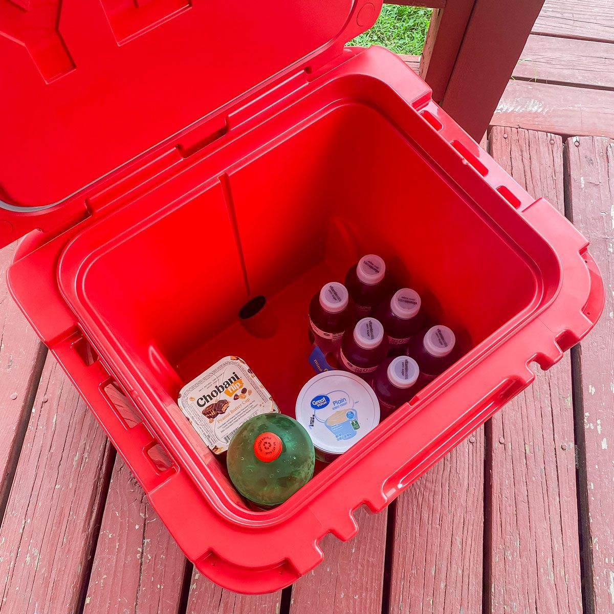 Yeti Roadie 48 Wheeled Cooler filled with cold beverages