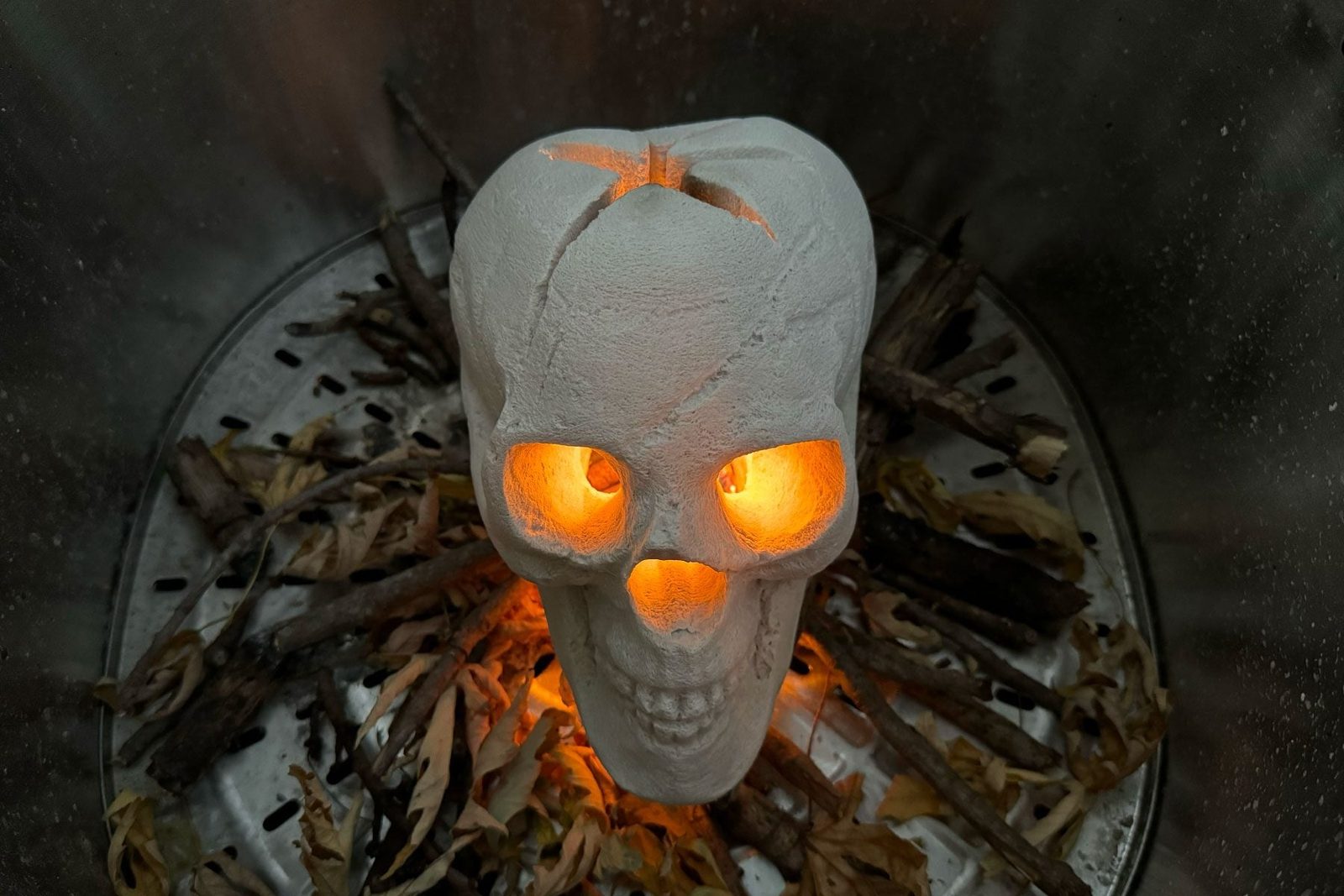 If You're Hosting a Halloween Party, You Need This Fire Pit Skull ASAP