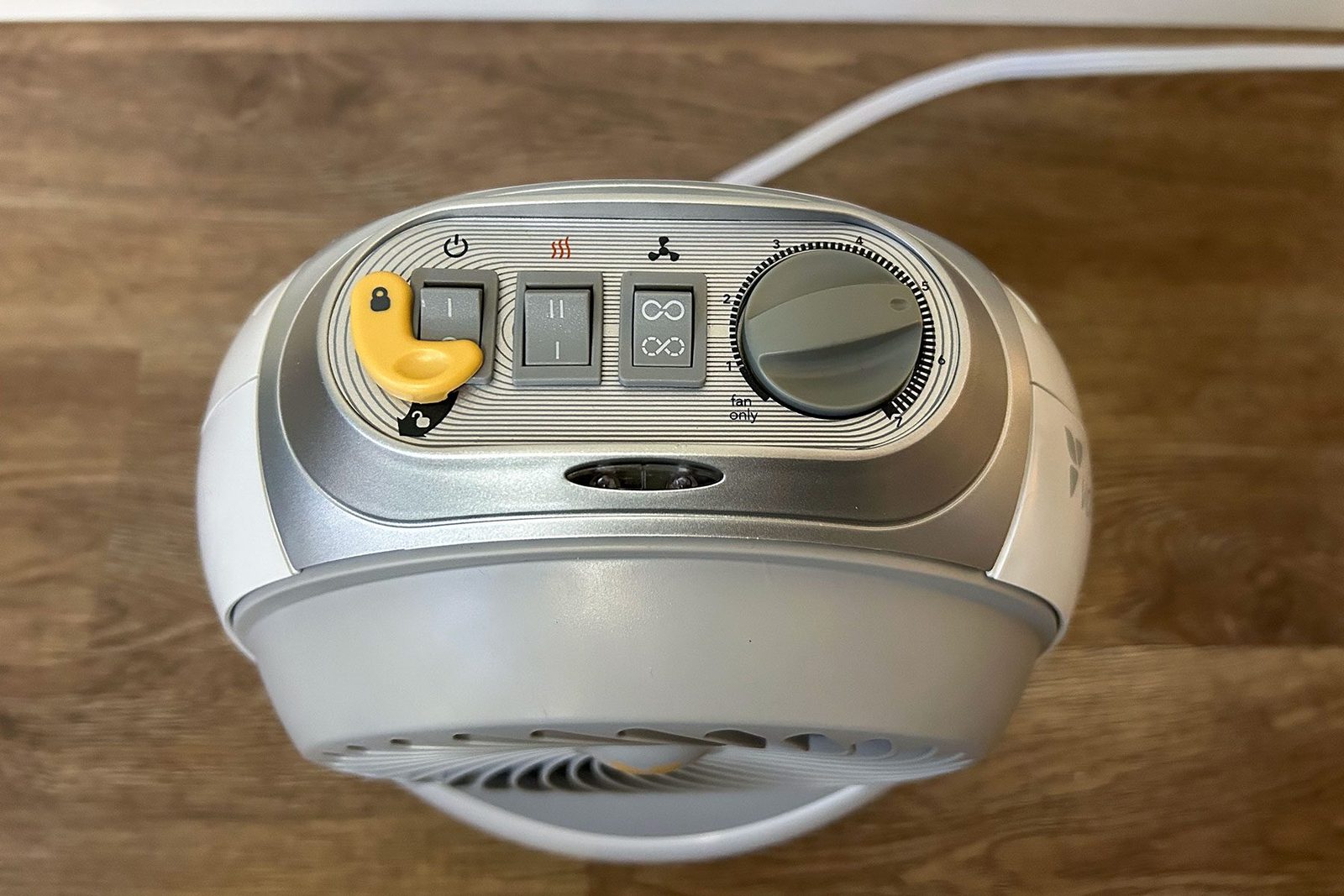 space heater top view with yellow button