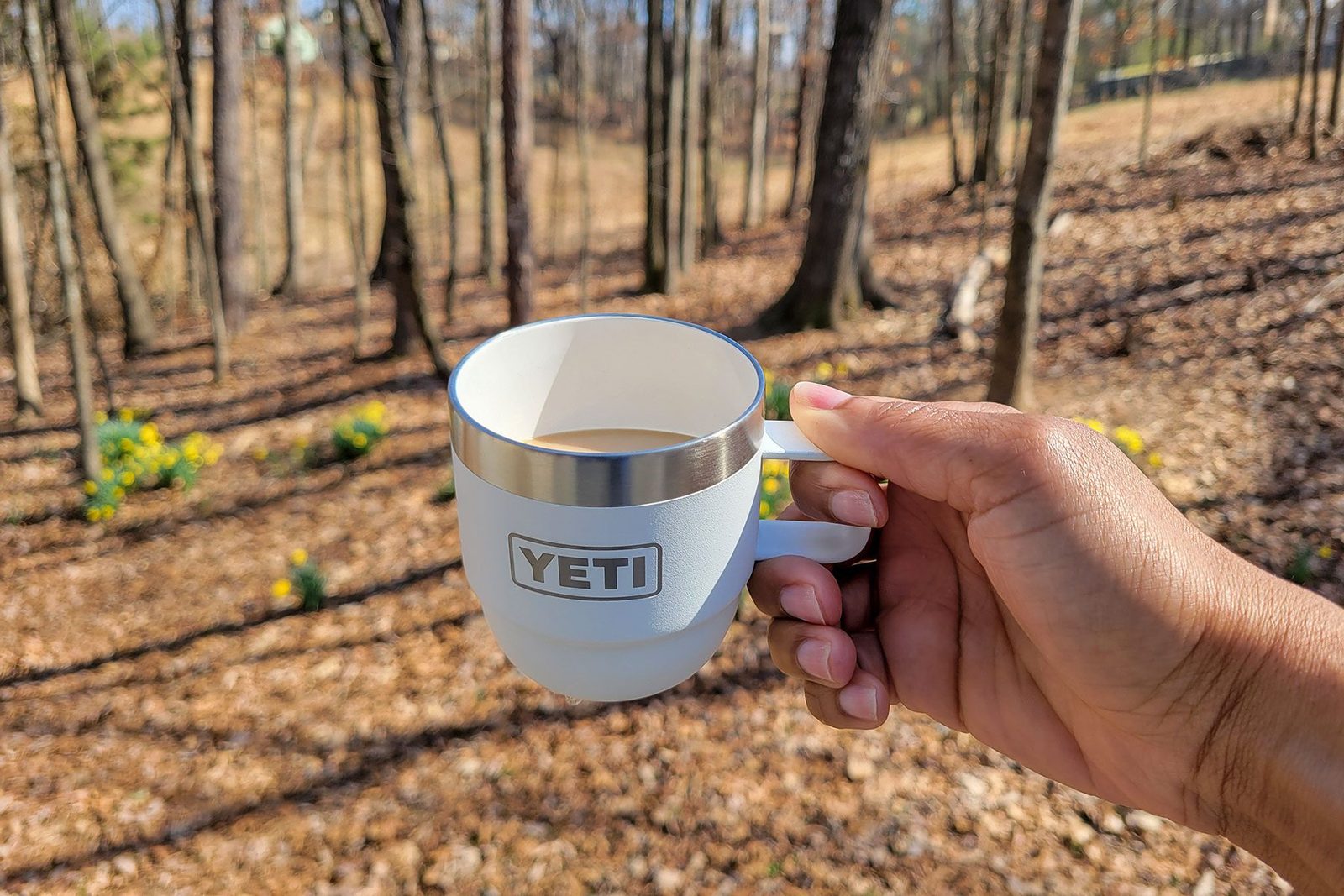 Holding Yeti’s New Stackable Cup in forest area