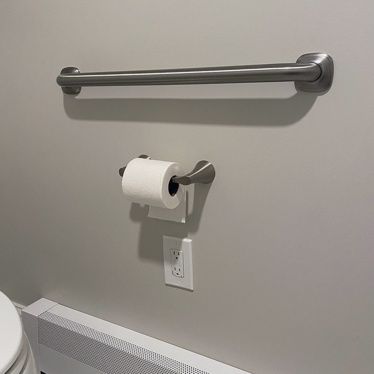 Grab bar on bathroom wall