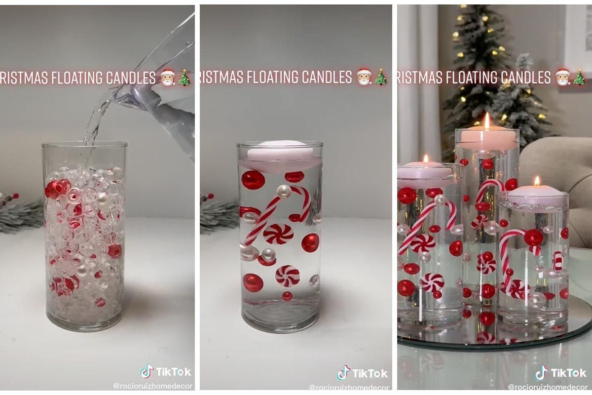 Three glass vessels contain floating candles and holiday decorations, surrounded by a festive setting with a decorated tree, creating a seas