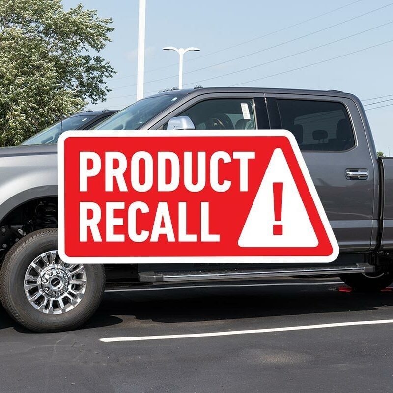Gray 2021 Ford F-250 Super Duty in a parking lot with a red "Product Recall" notice overlaid in front
