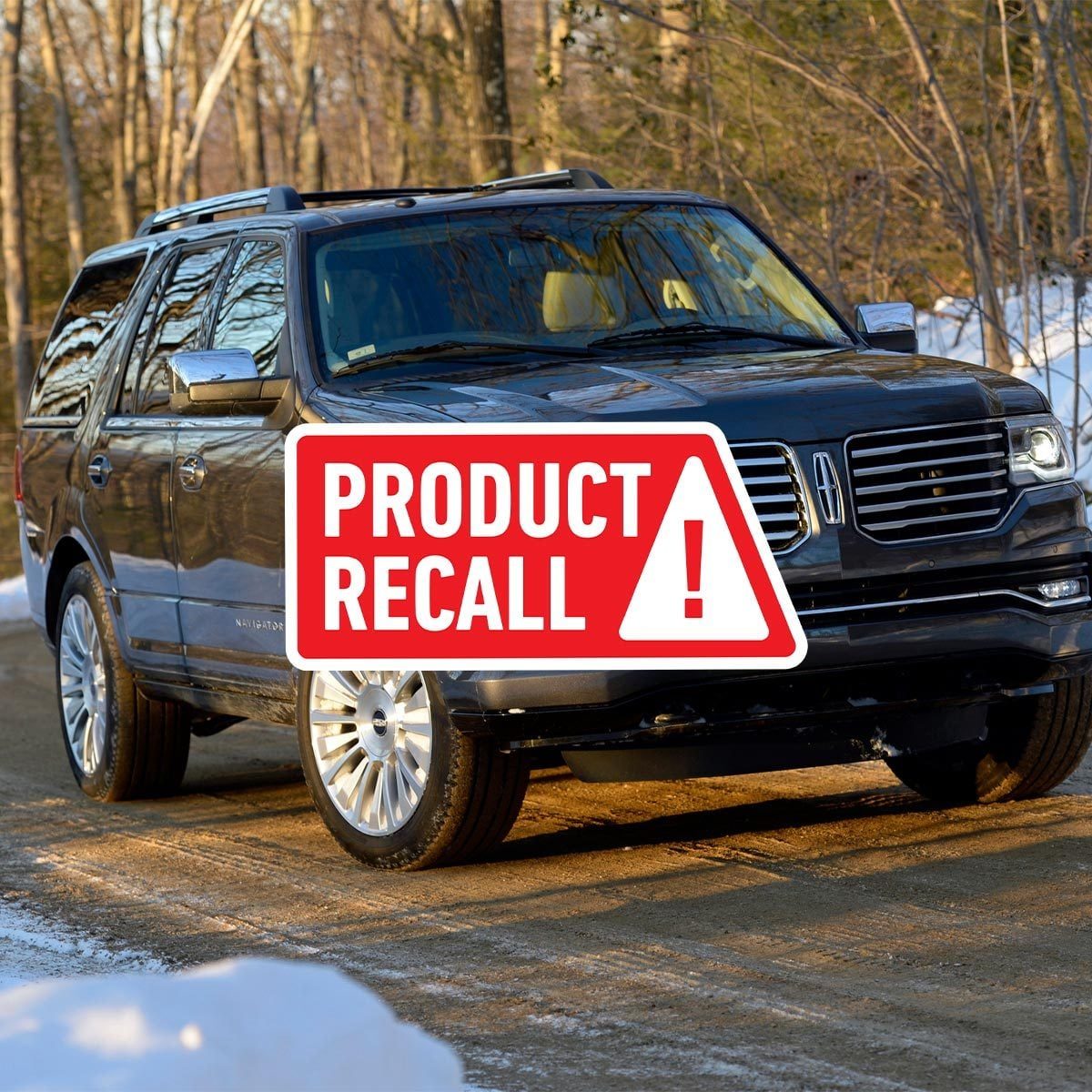 2015 Lincoln Navigator driving on snow road with a red "product recall" sticker overlaid