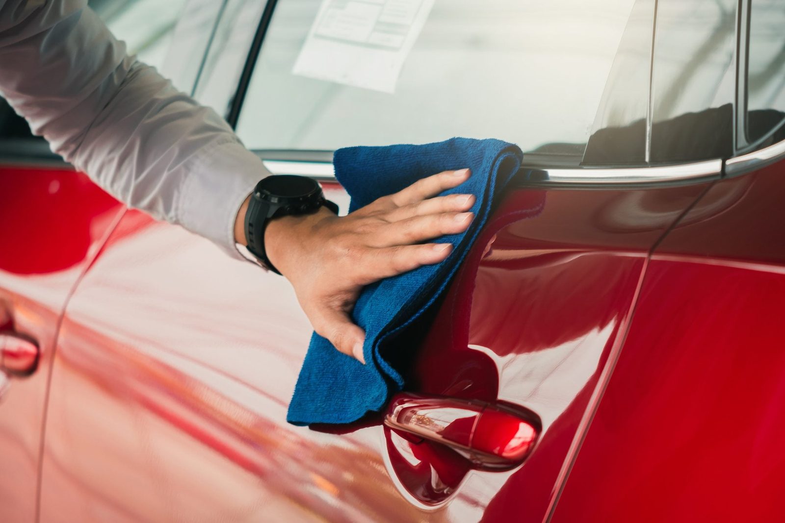 Man asian inspection and cleaning Equipment car wash With red car For cleaning to quality to customer on car showroom of service transport automobile transportation automotive