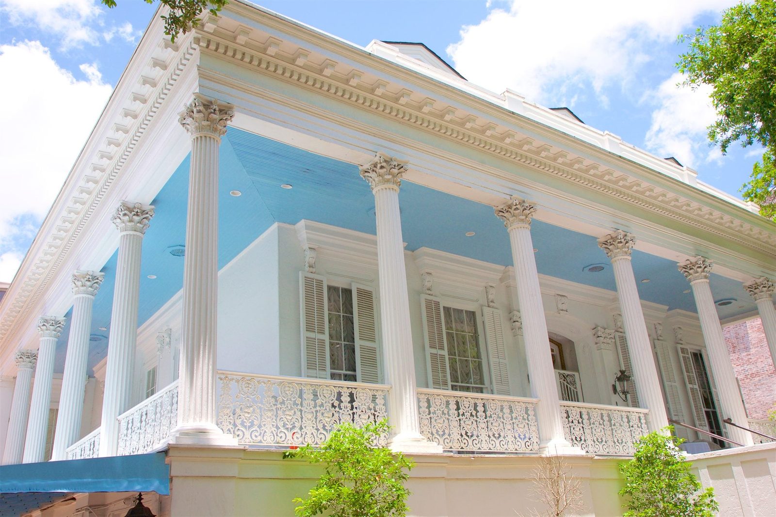 New Orleans mansion with exterior columns and a blue porch ceiling