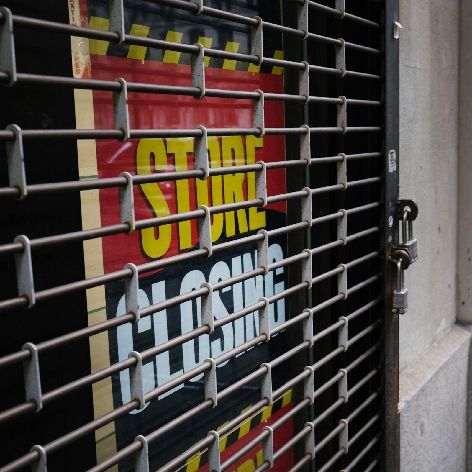 Closed store sign with grate in front