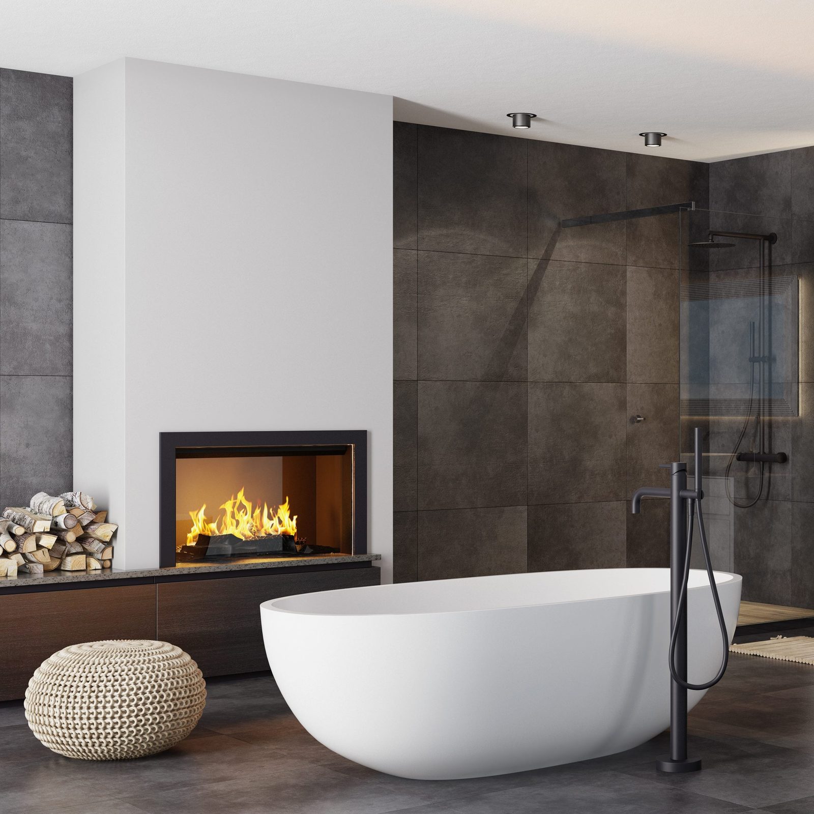 A freestanding white bathtub rests on dark tiles, beside a cozy fireplace; wood logs stack nearby, with a modern shower area visible in the