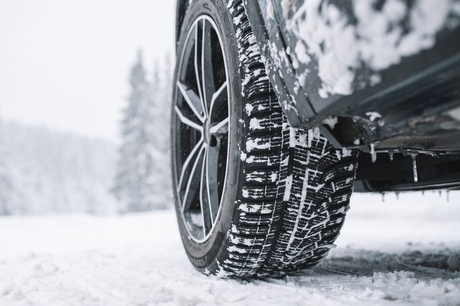 Close Up Of Car Tyre On Snowy Road