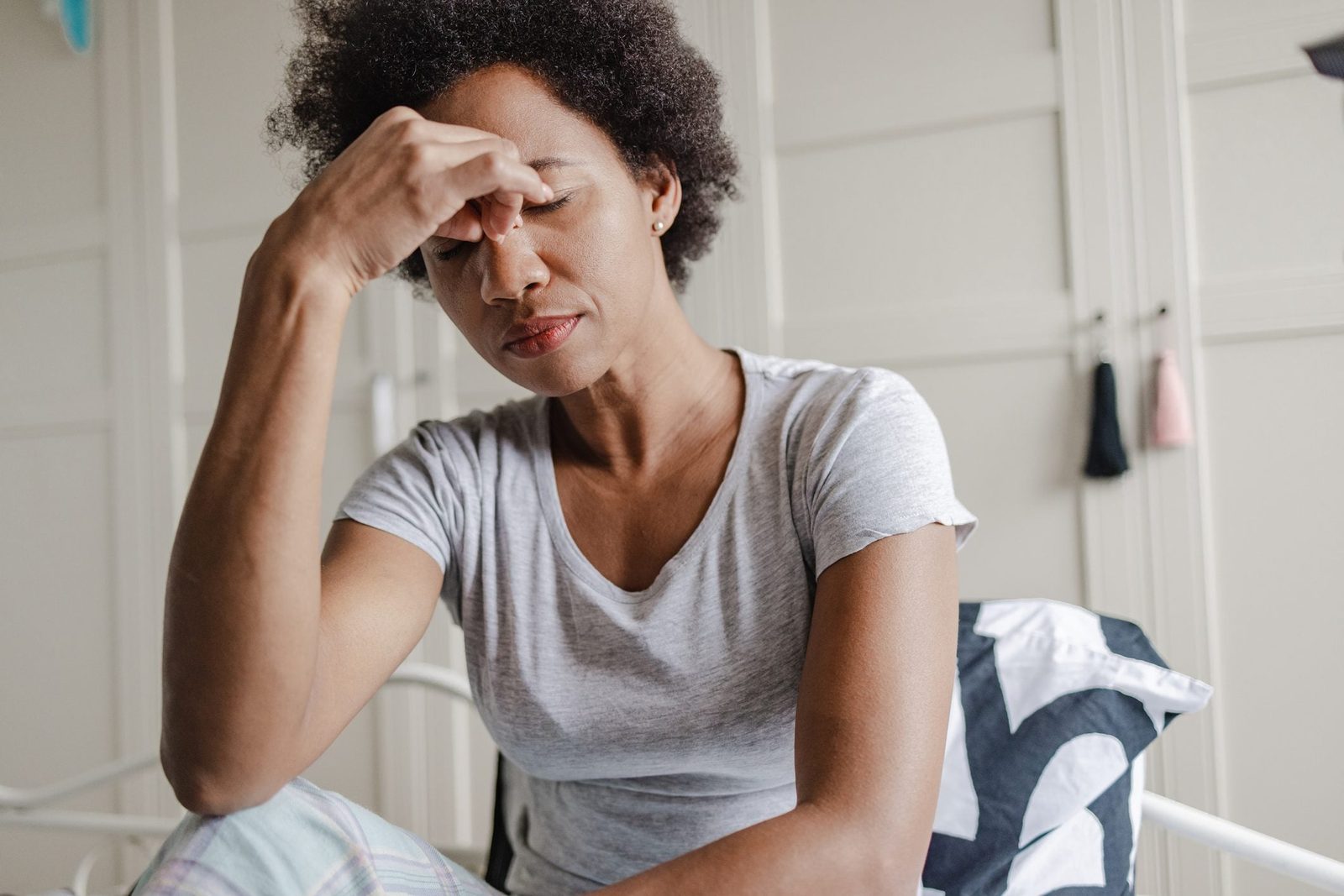 woman in pain from a headache and carbon monoxide poisoning