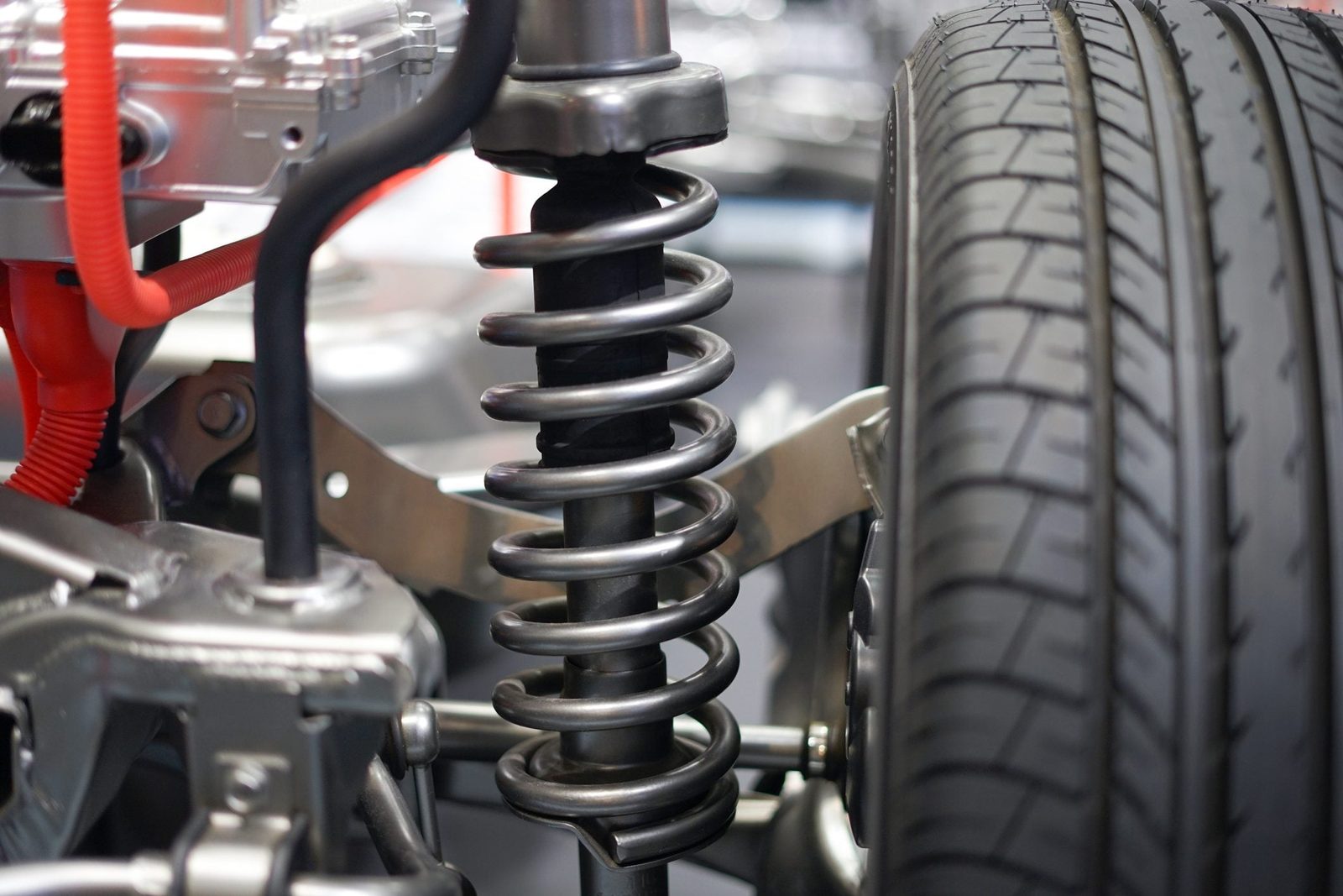 Close up of automobile shock absorbers and springs in an automotive service repair center shop