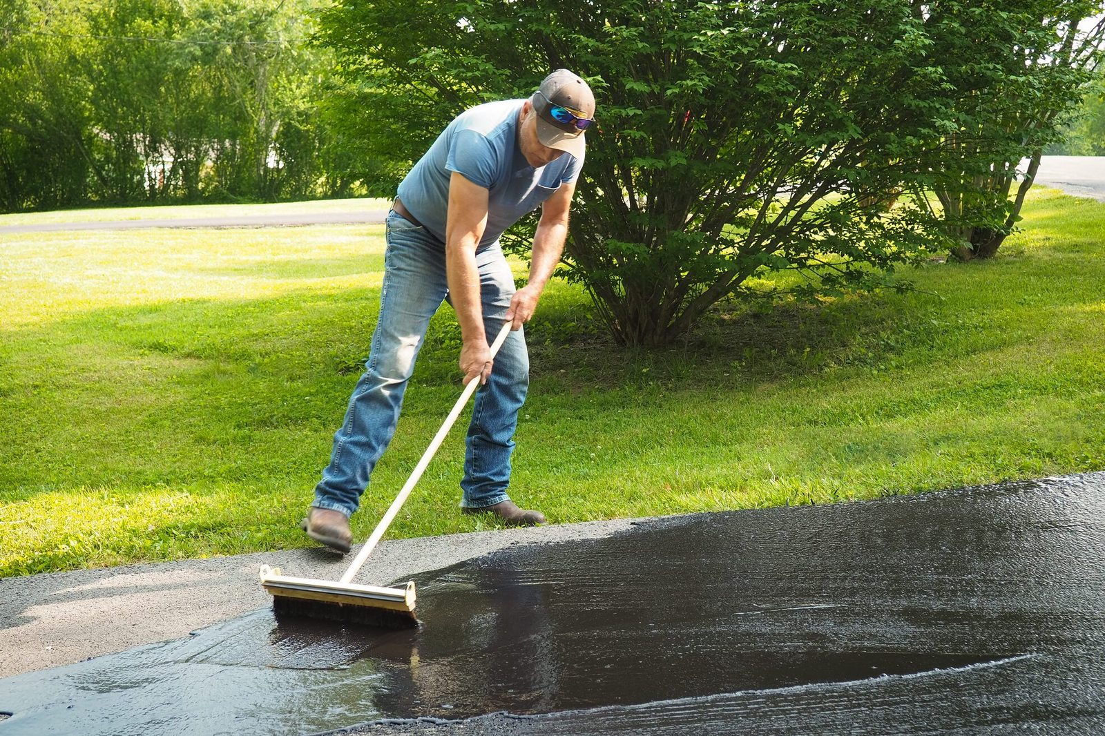 Man sealing driveway