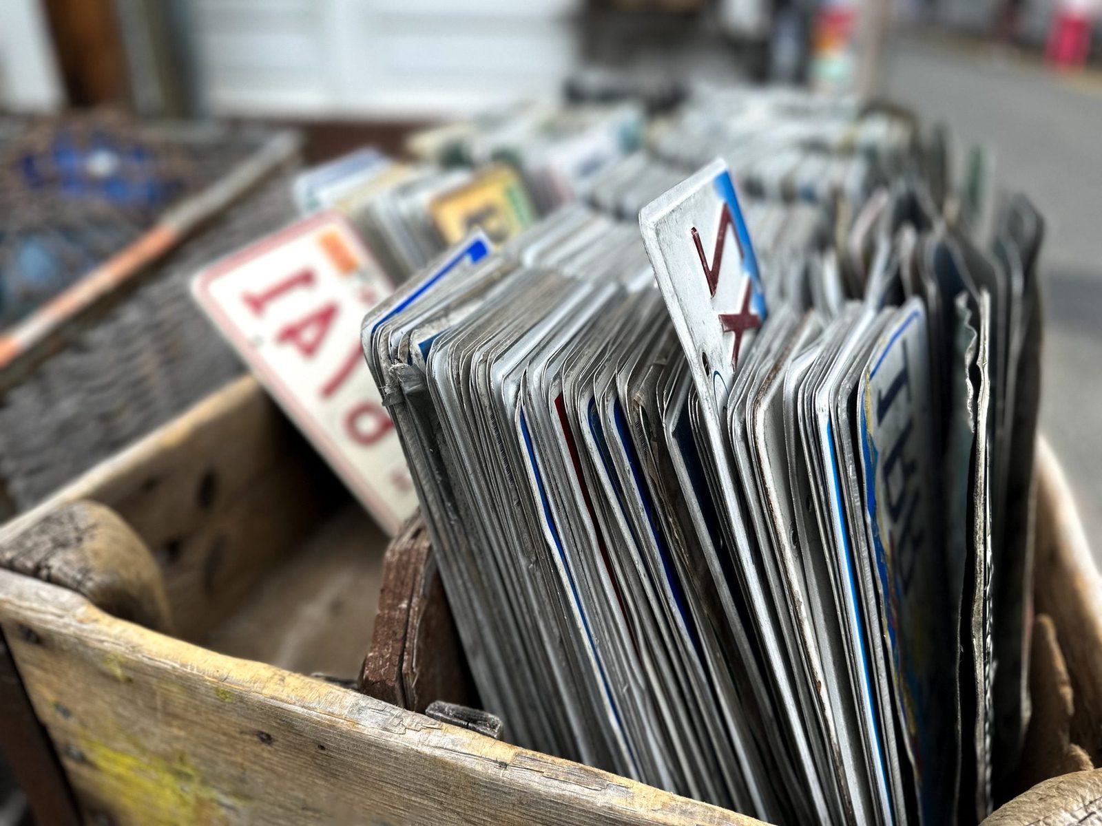 vintage vehicle license plates for sale at flea market