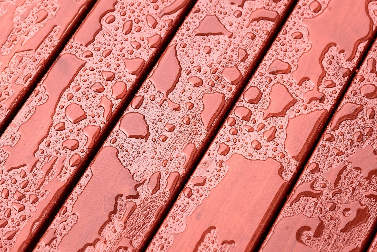 red painted deck with water dropplets