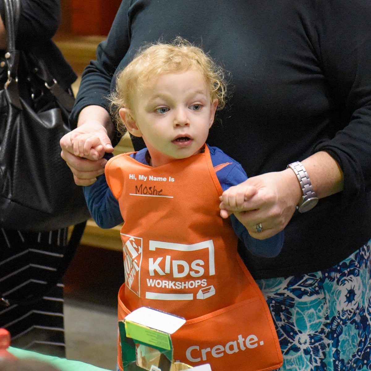 child at Home Depot kids workshop