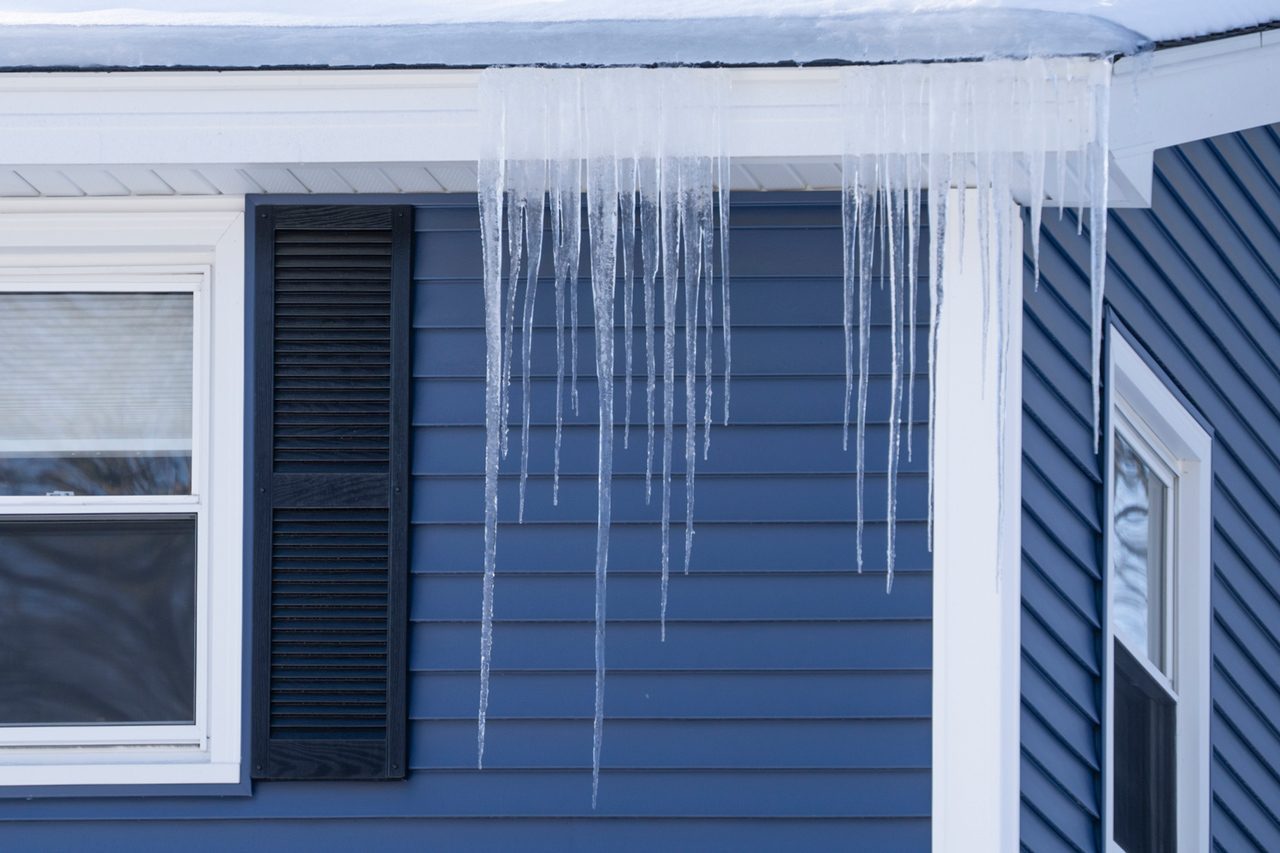 house with icicle and snow on the roof