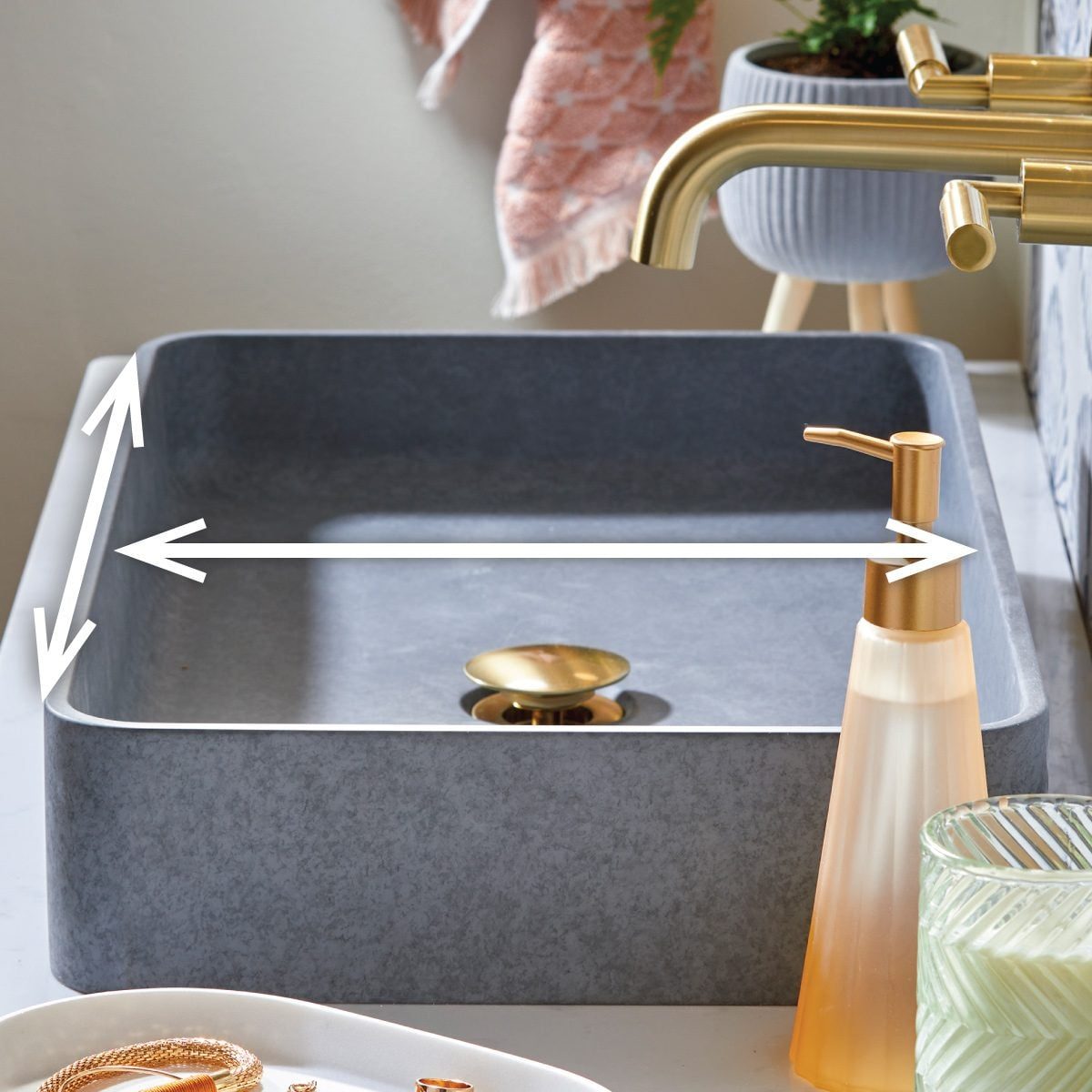 Homeowner's Guide To Bathroom Sink Dimensions And Sizes with arrow pointers indicating length and width.