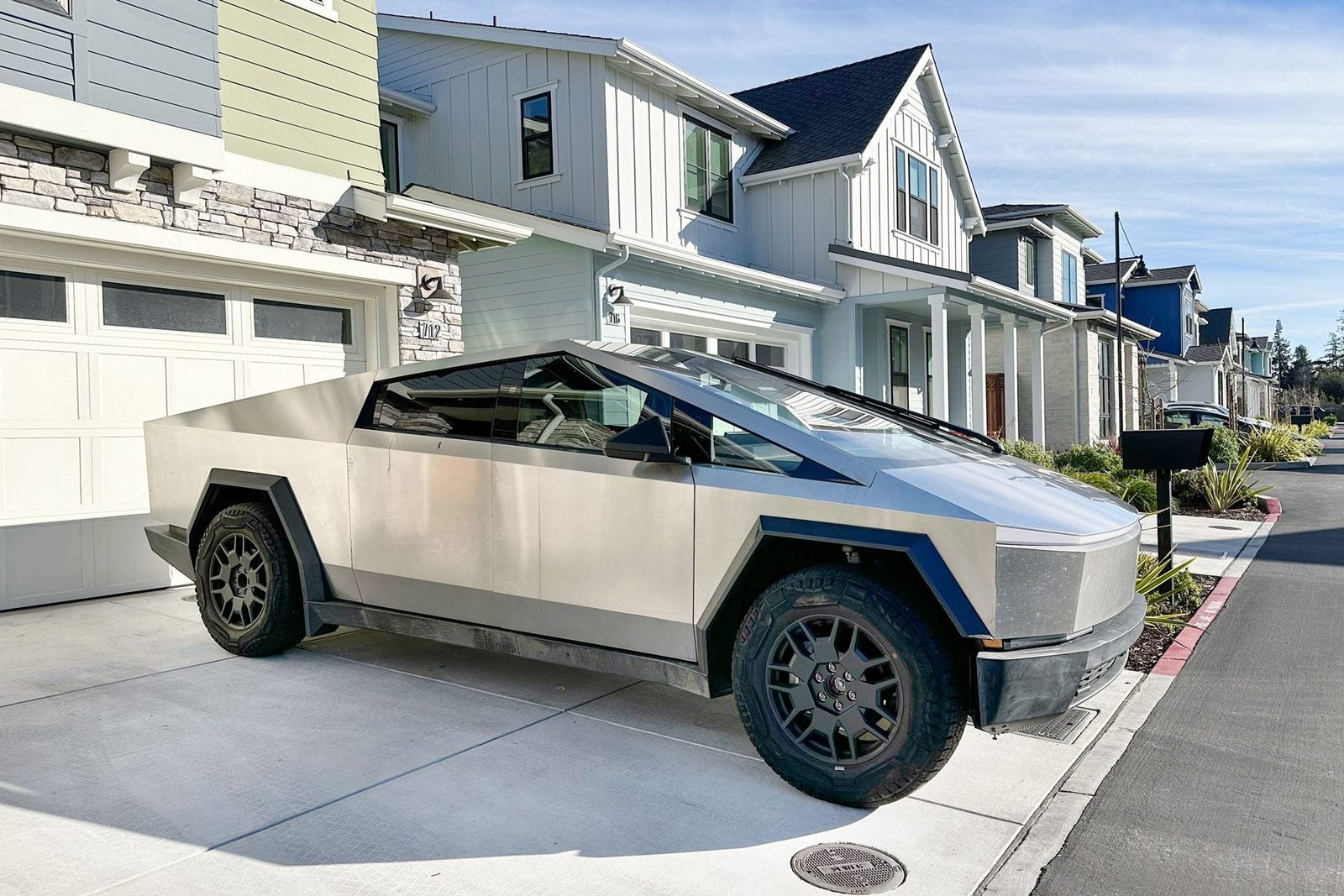 Tesla Cybertruck in front of a house