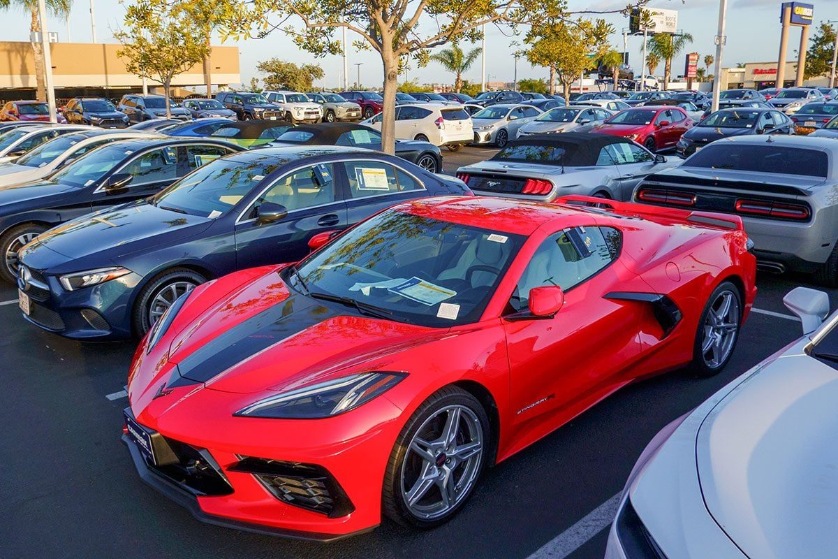 Vehicles for sale are parked in a lot at a CarMax dealership