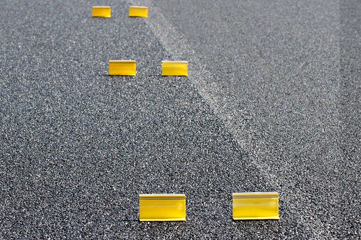 Temporary reflectorized raised pavement markers on the road