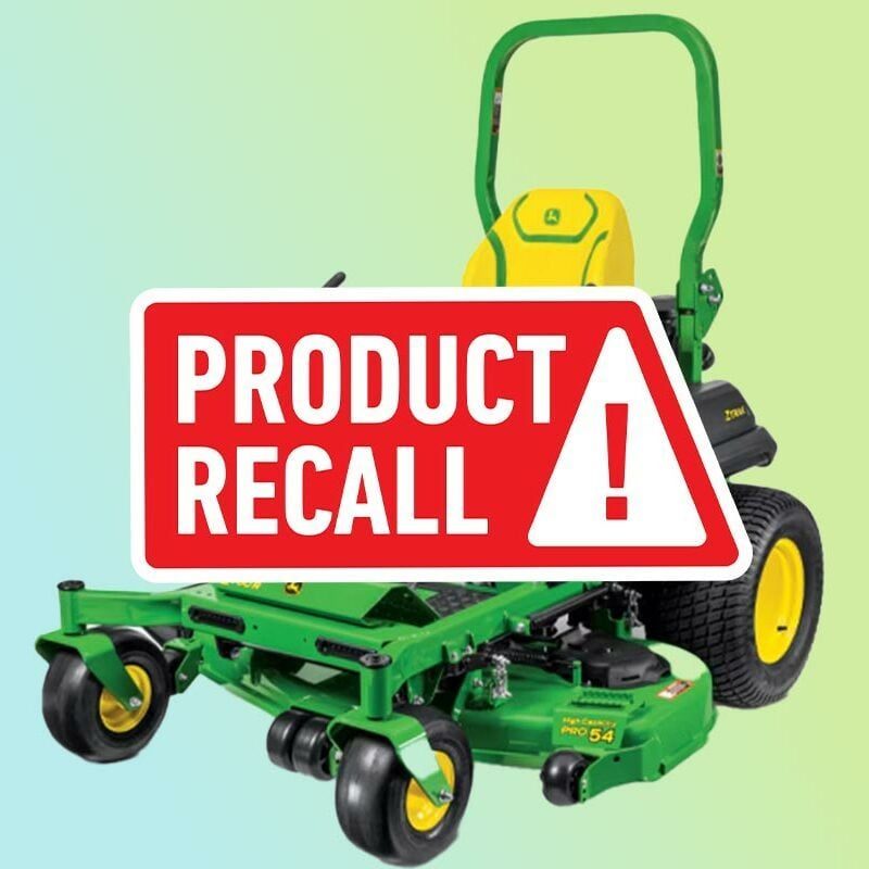 John Deere lawnmower on a blue and green background with a red "product recall" sticker overlaid