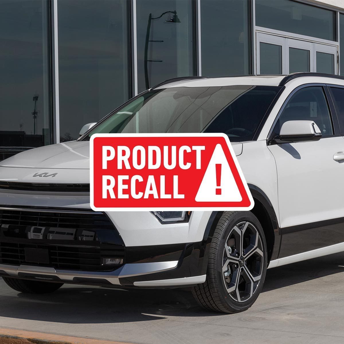 White 2023 Kia Niro electric SUV with a red "product recall" sticker overlaid