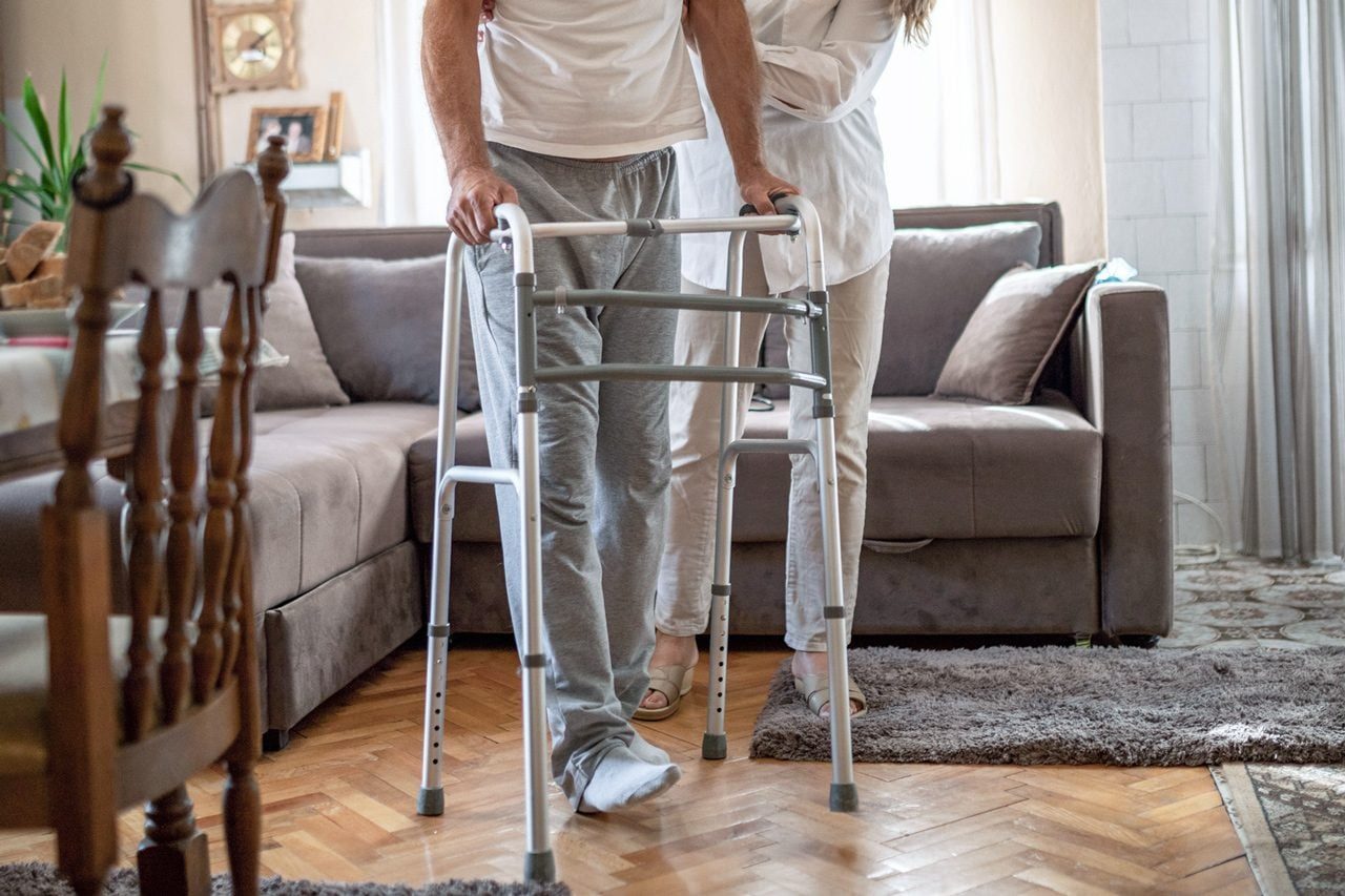 man using a walker at home