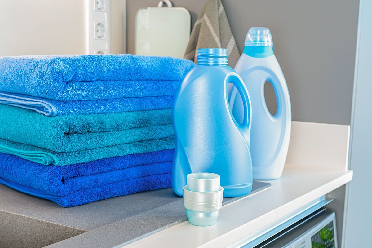 Blue fabric softener and detergent bottles