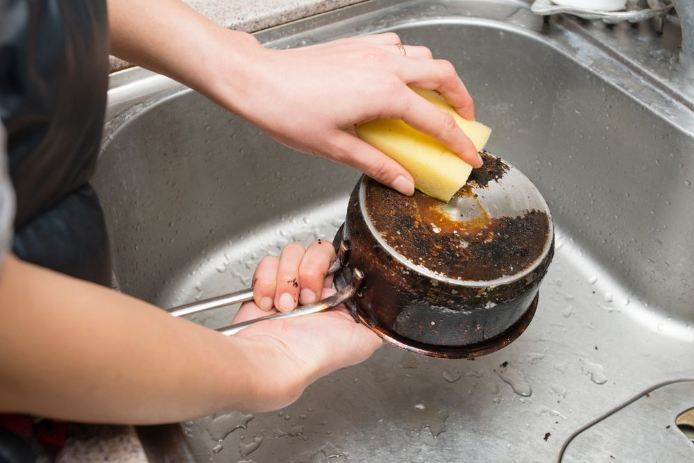 Here's How to Clean A Burnt Pot or Pan with Two Ingredients