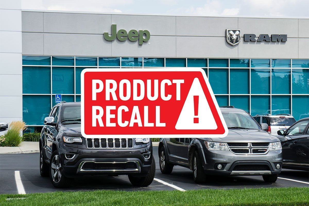 Product Recall overlay over a background image of jeep and dodge suvs at a dealership