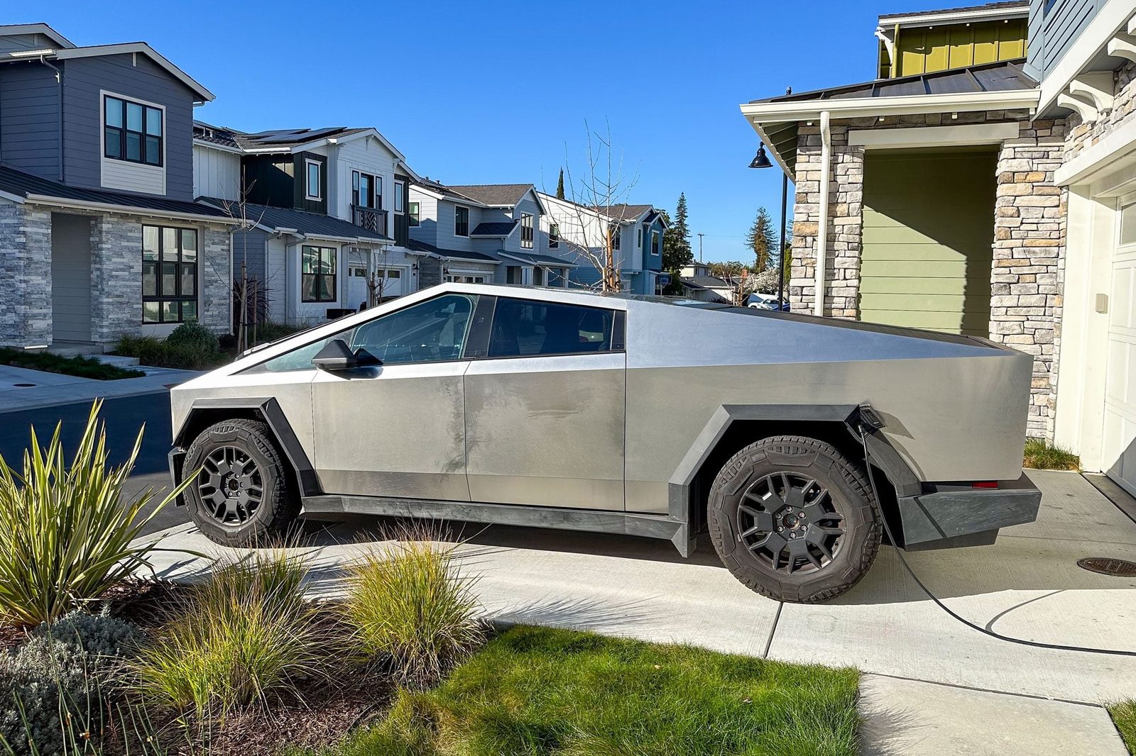 Tesla Cybertruck Charging In Driveway