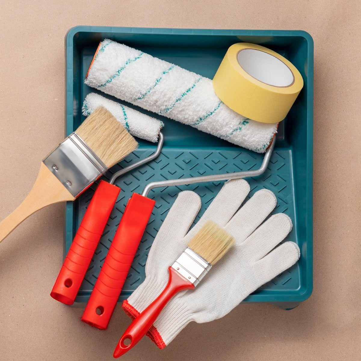 Painting tools and materials. Rollers, masking tape, tray and brush