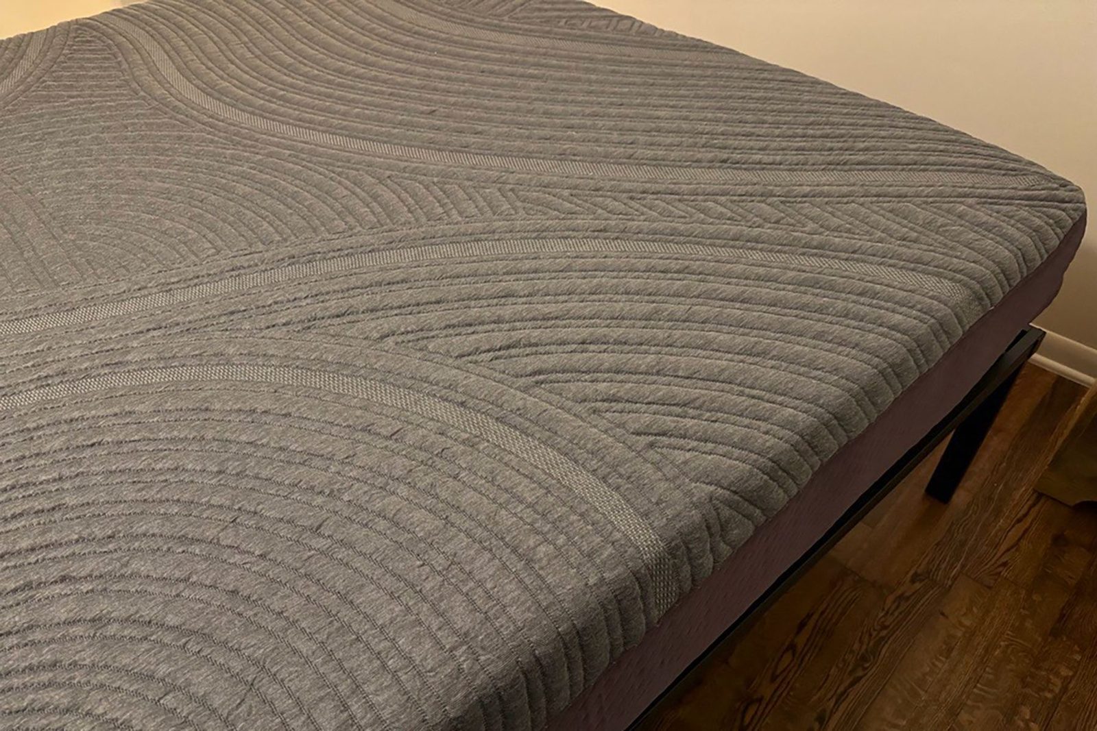 A bed with a mattress on top of it.