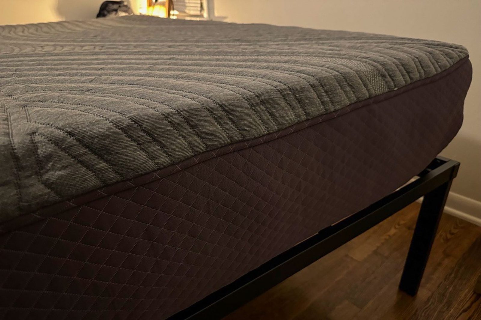 A bed with a mattress on top of it.