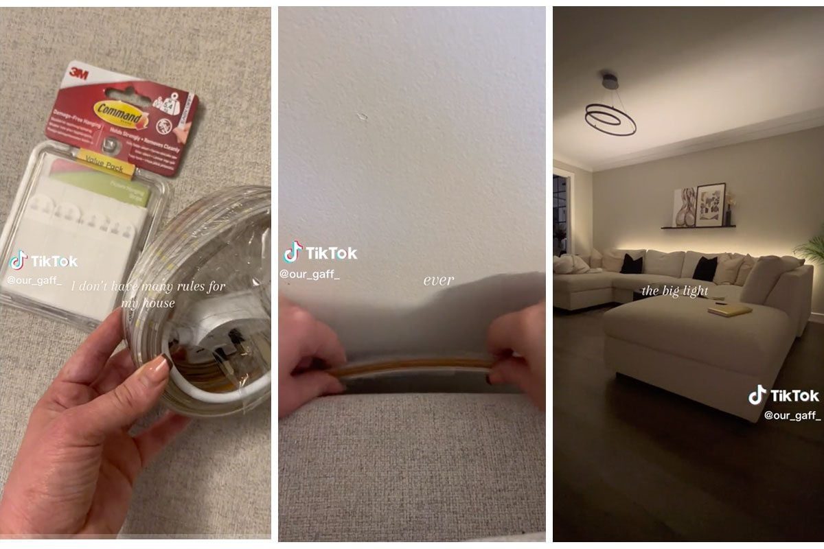 A person installs a cord cover on a wall, showcasing a well-lit living room with a sectional sofa and decorative elements.