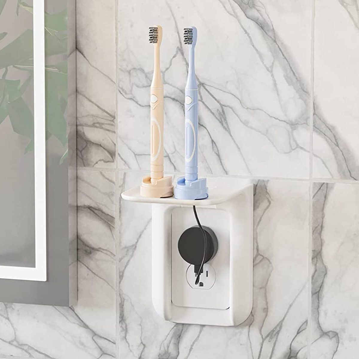 This Clever Wall Outlet Shelf Makes a Convenient Home for Charging Gadgets