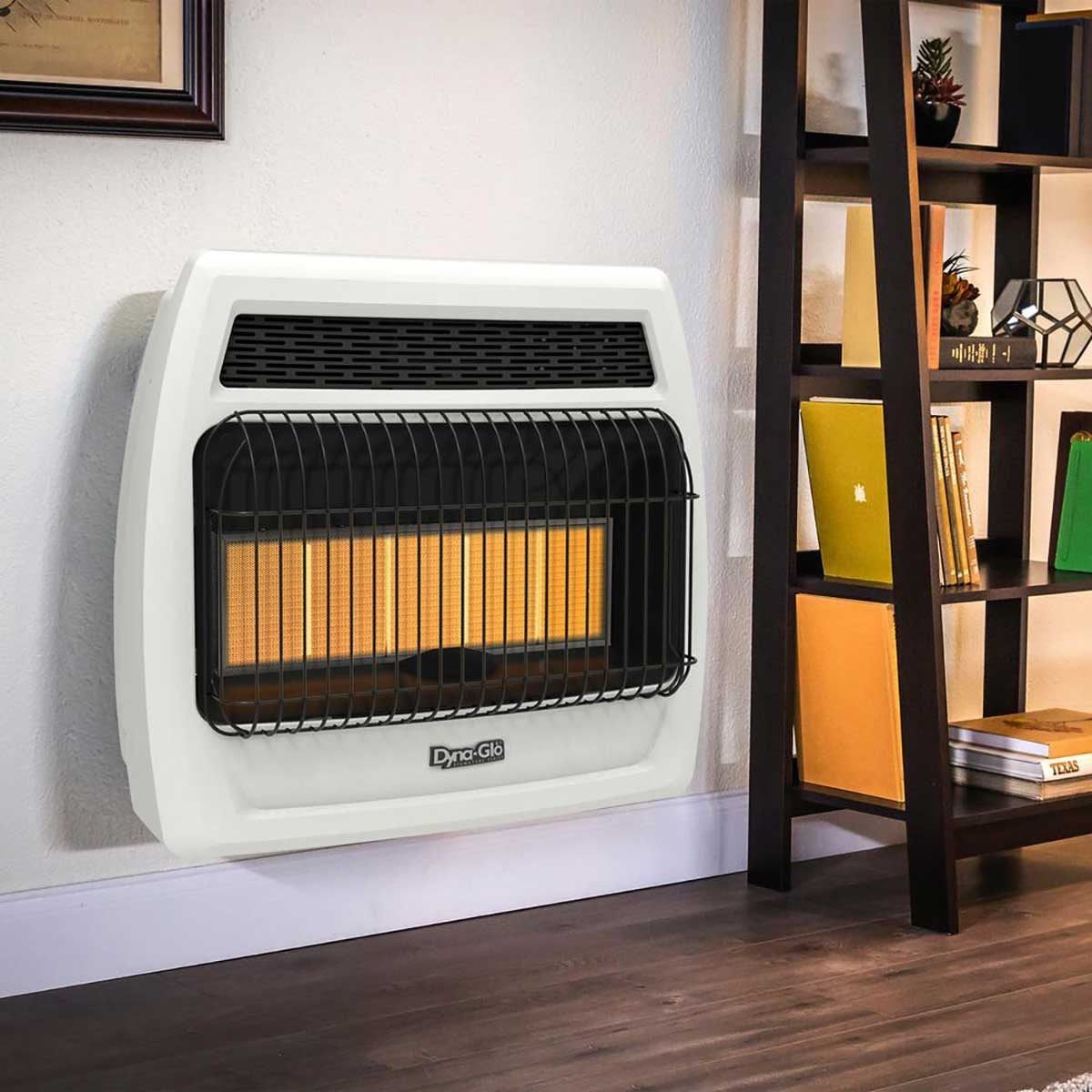A wall-mounted heater emits heat, situated near a bookshelf filled with books and decorative items, enhancing the room's warmth and comfort.