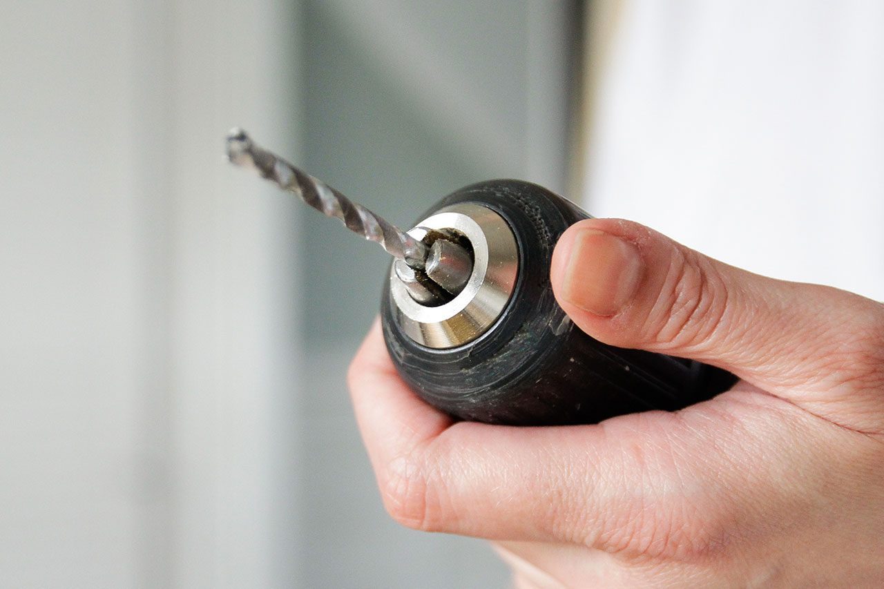 Person holds a drill
